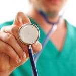 Doctor holding stethoscope (with shallow depth of field)
